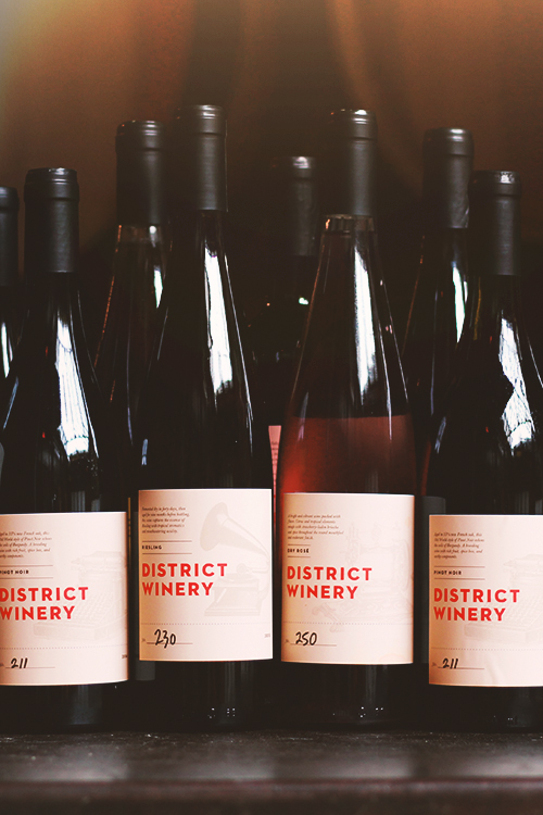 District Winery bottles of Pinot Noir, Riesling, and Dry Rosé