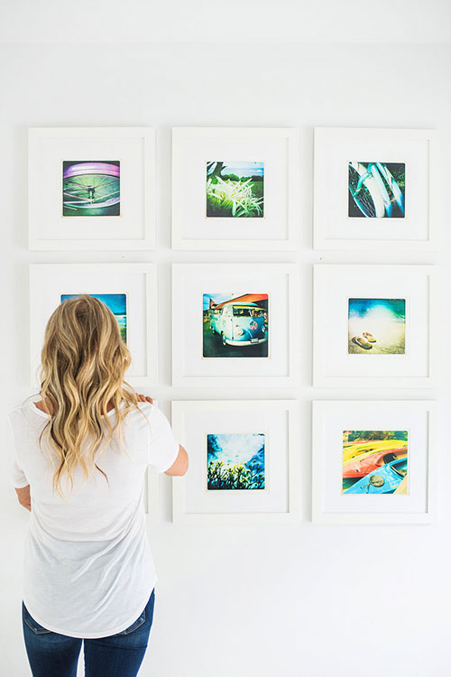 Woman looking at photos in art gallery exhibit in DC