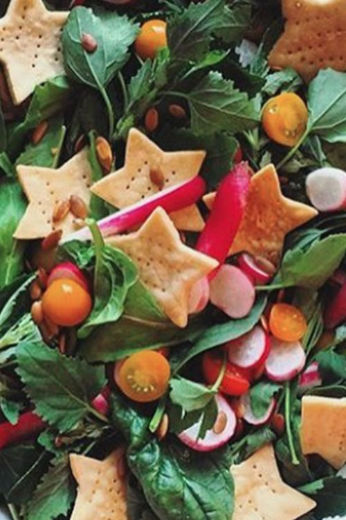 Festive holiday salad with star shaped crackers